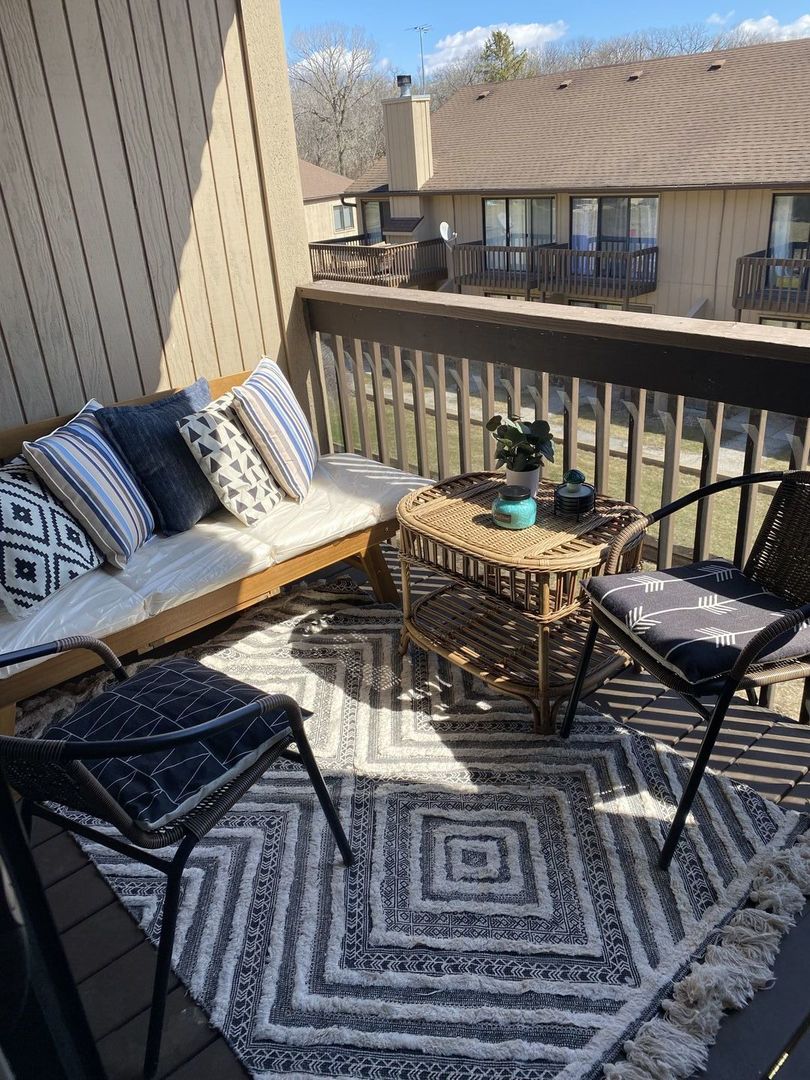 55 Vail Colony, Unit 6 Fox Lake, IL 60020 - Photo 11 of 23 a view of a chairs and table in the balcony