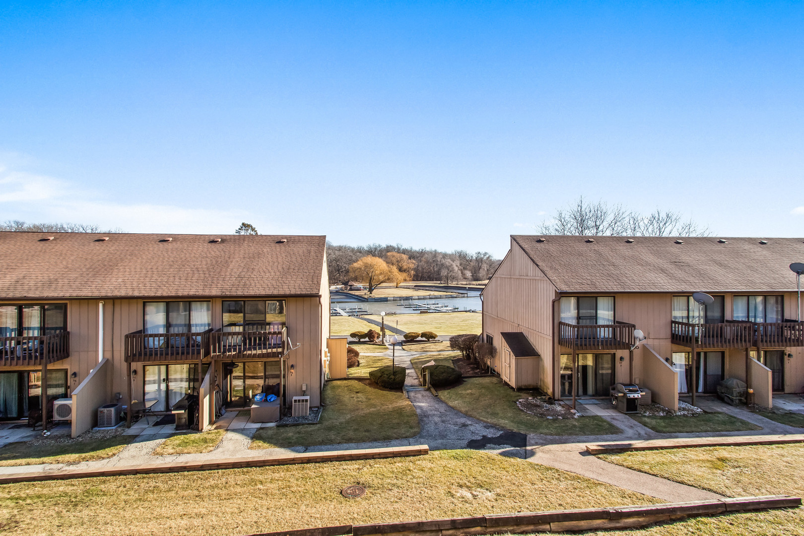 55 Vail Colony, Unit 6 Fox Lake, IL 60020 - Photo 13 of 23 a view of a town with large trees