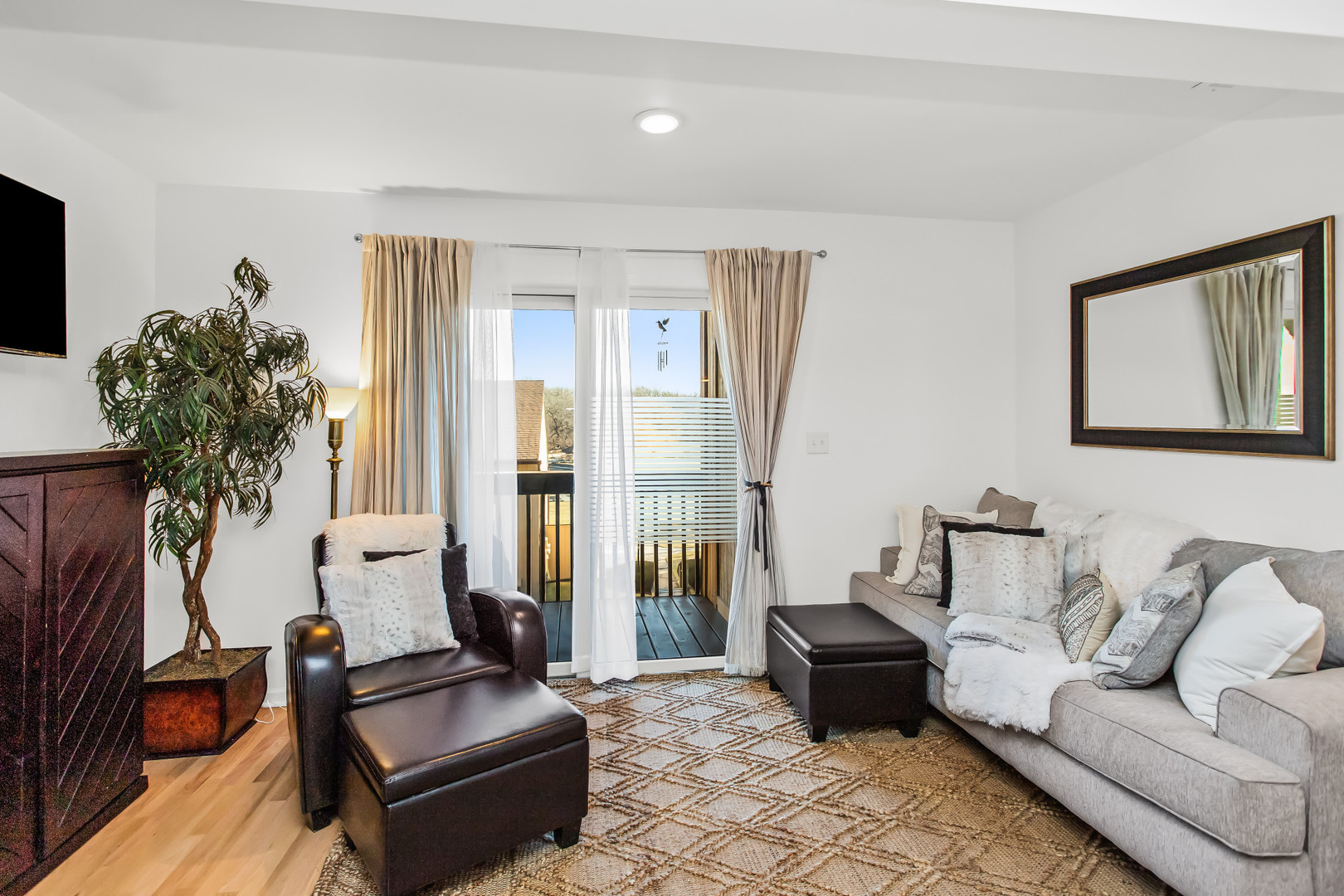 55 Vail Colony, Unit 6 Fox Lake, IL 60020 - Photo 2 of 23 a living room with furniture and a large window