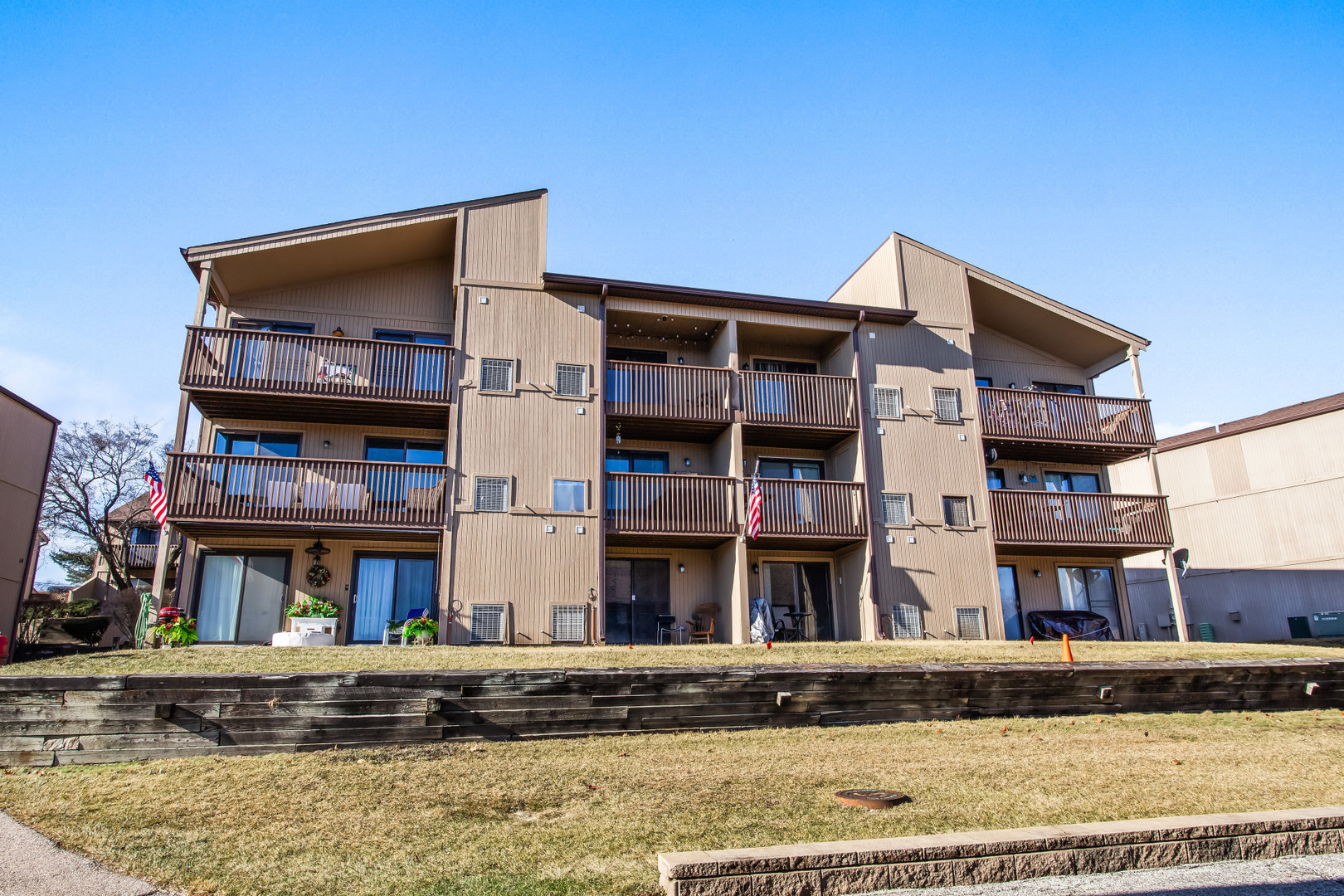 55 Vail Colony, Unit 6 Fox Lake, IL 60020 - Photo 21 of 23 a view of a building with a balcony