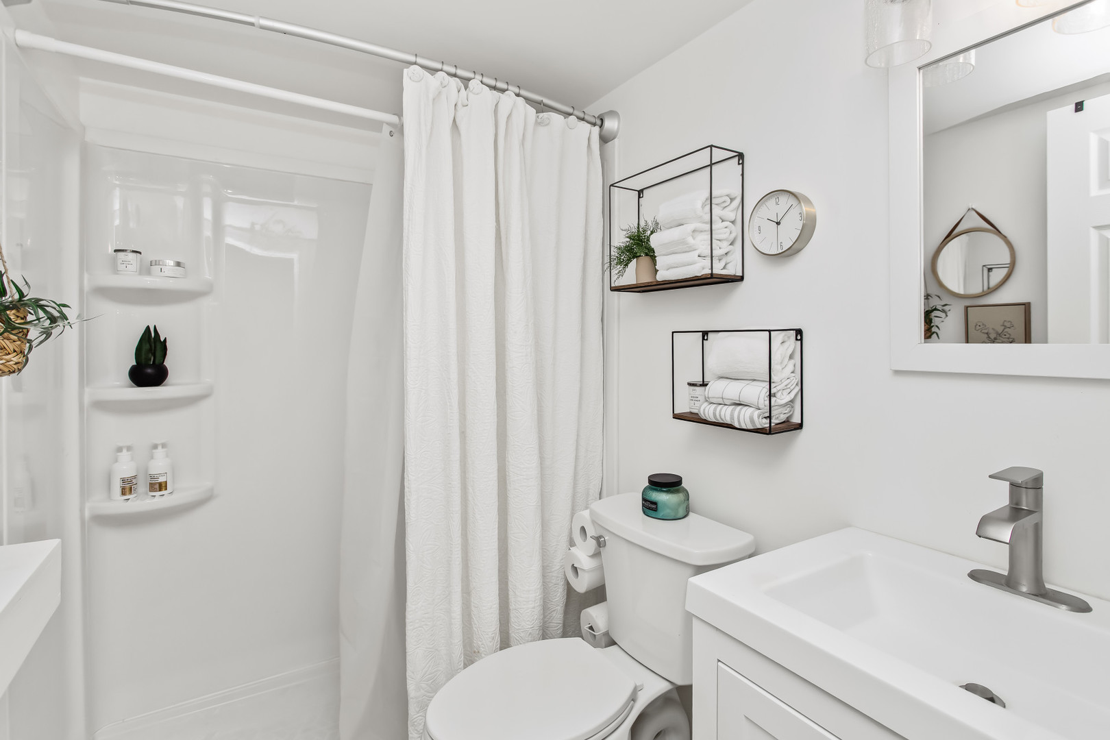 55 Vail Colony, Unit 6 Fox Lake, IL 60020 - Photo 9 of 23 a bathroom with a toilet a sink and mirror