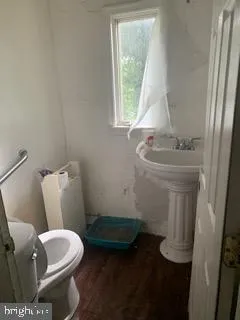 a bathroom with a toilet and a sink