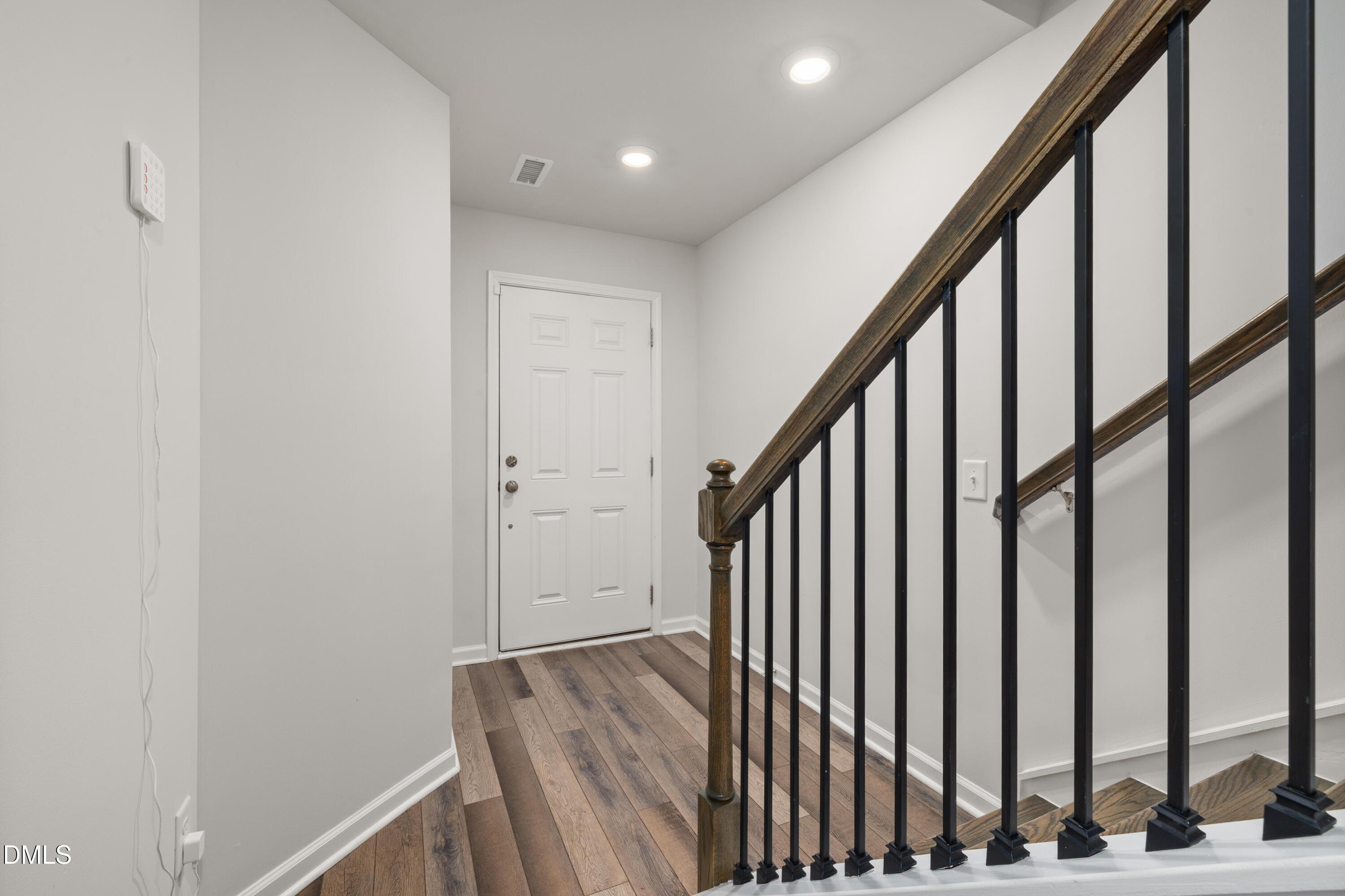 2524 Laurel Valley Way Raleigh, NC 27604 - Photo 5 of 12 a view of staircase with railing and white walls