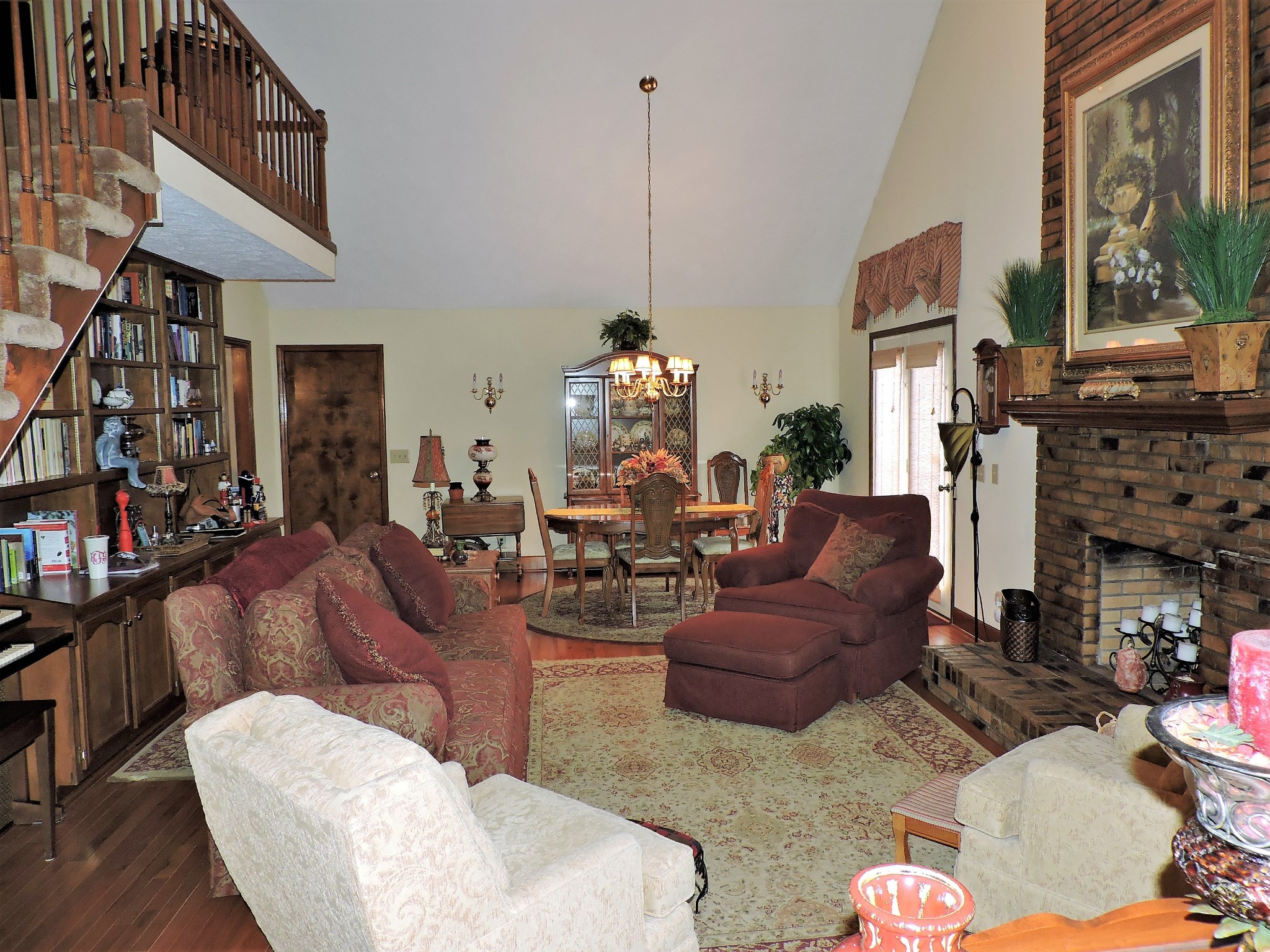 3581 Franklin Road Lebanon, TN 37090 - Photo 18 of 42 a living room with furniture a fireplace and a chandelier