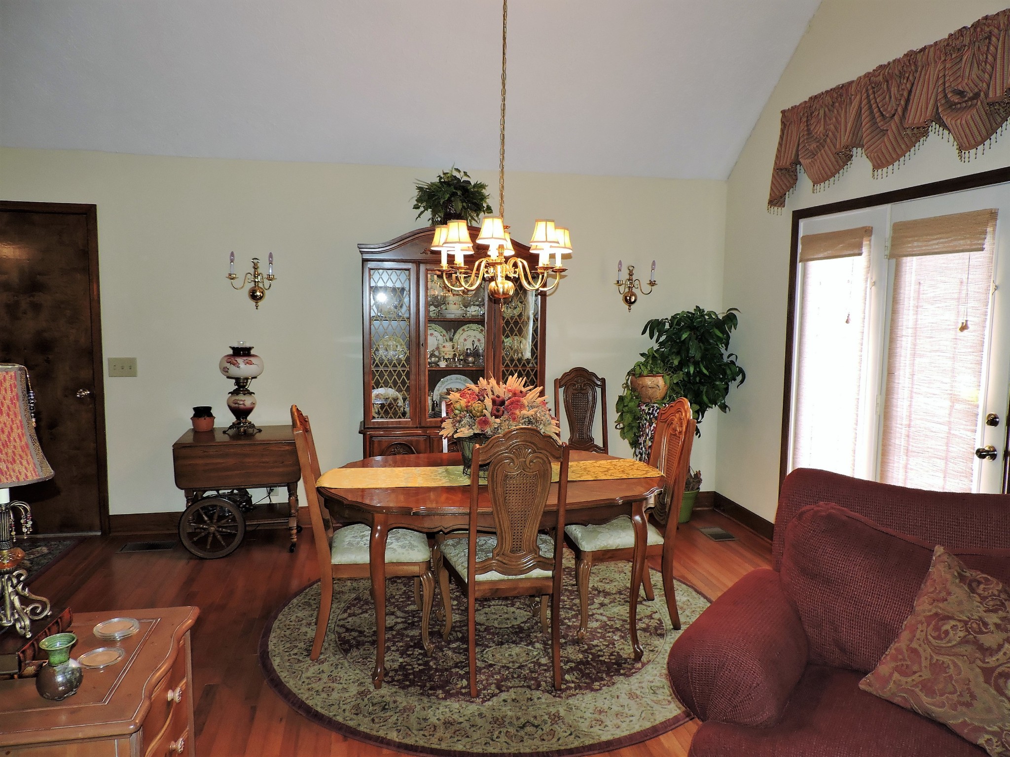 3581 Franklin Road Lebanon, TN 37090 - Photo 19 of 42 a dining room with furniture a chandelier and wooden floor