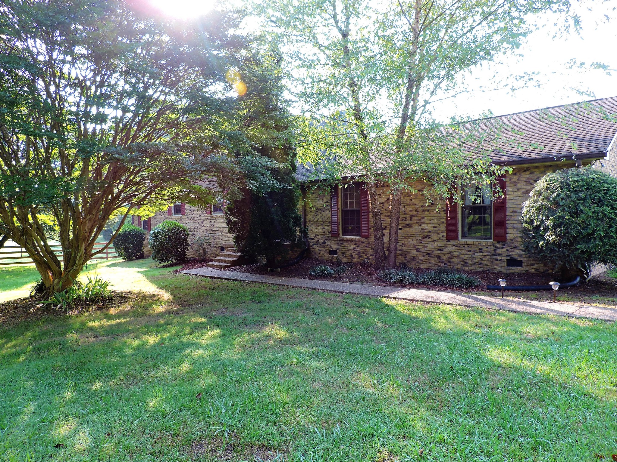 3581 Franklin Road Lebanon, TN 37090 - Photo 4 of 42 a view of backyard with table and chairs and potted plants and large trees