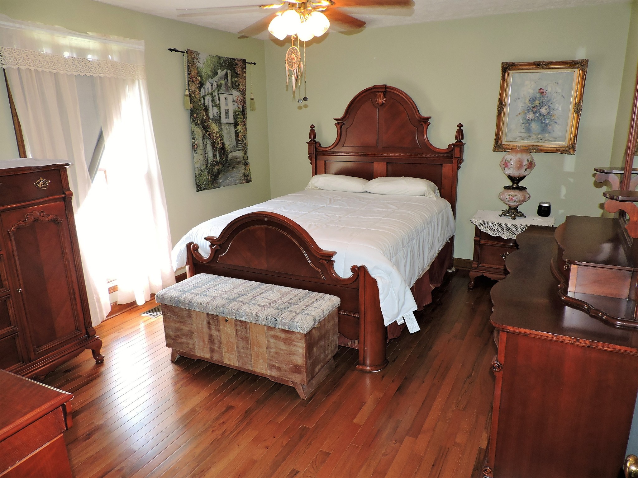 3581 Franklin Road Lebanon, TN 37090 - Photo 36 of 42 a bedroom with a bed and a chandelier