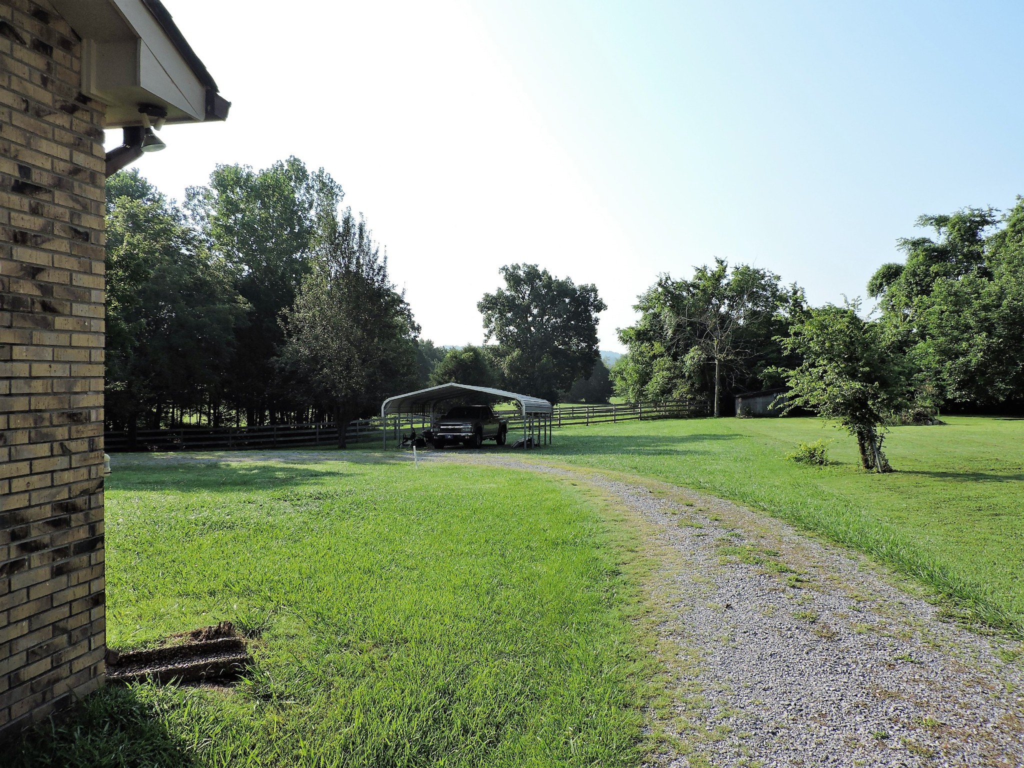 3581 Franklin Road Lebanon, TN 37090 - Photo 7 of 42 a white house with a big yard and large trees