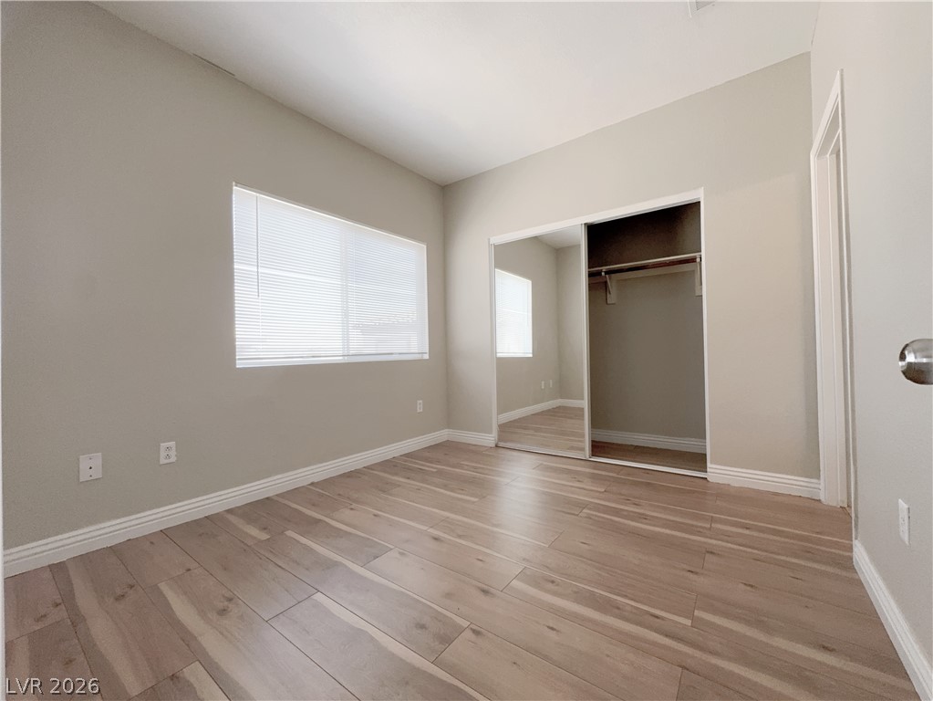 8725 West Flamingo Road, Unit 208 Las Vegas, NV 89147 - Photo 11 of 16 This bright room features beautiful hardwood flooring and a convenient mirrored closet.