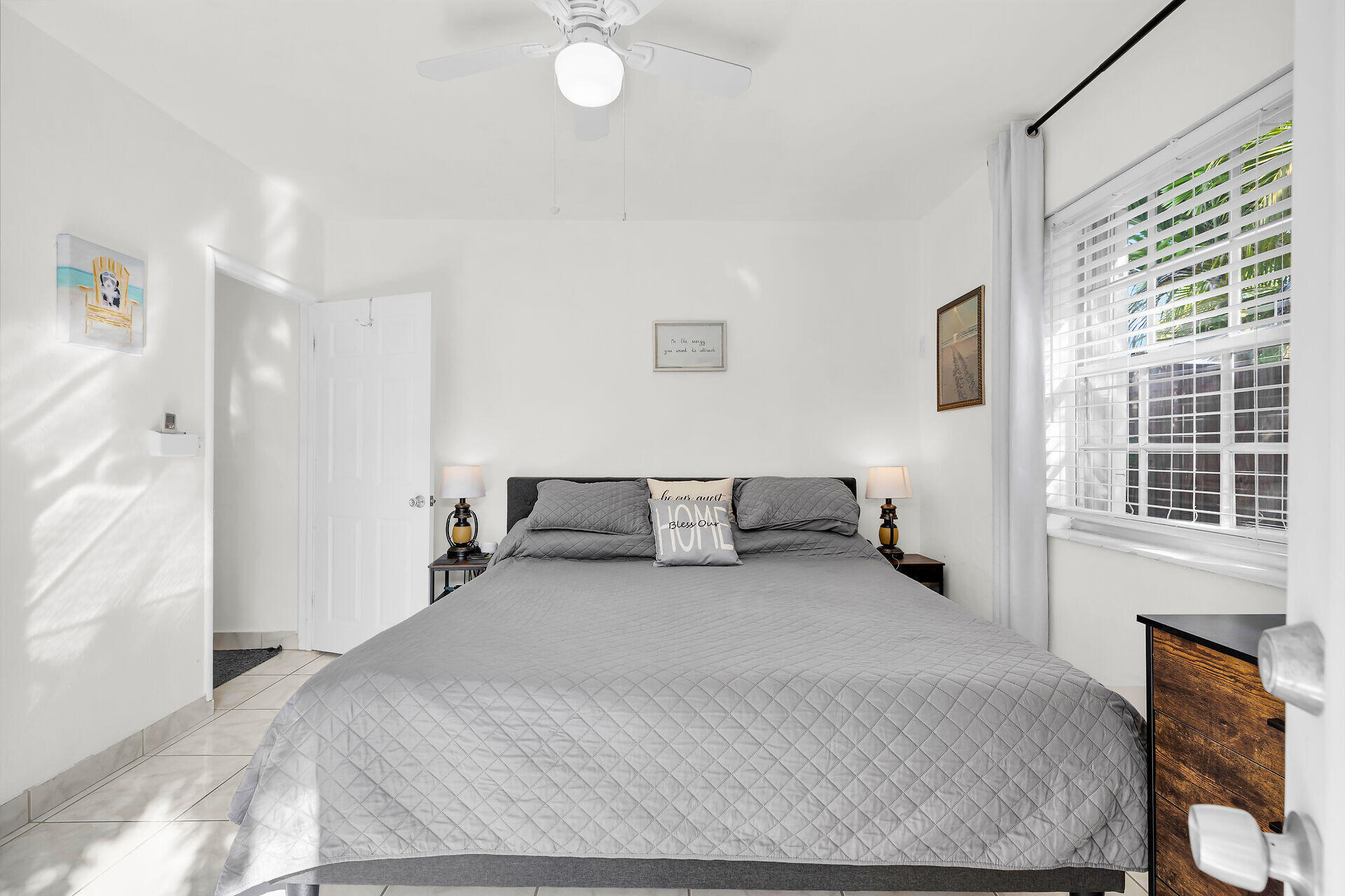 1119 Simonton Street, Unit A1 Key West, FL 33040 - Photo 11 of 18 a bed room with a bed and a chair