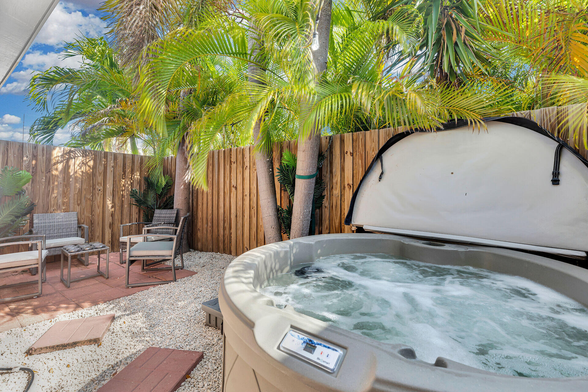 1119 Simonton Street, Unit A1 Key West, FL 33040 - Photo 14 of 18 a backyard of a house with table and chairs