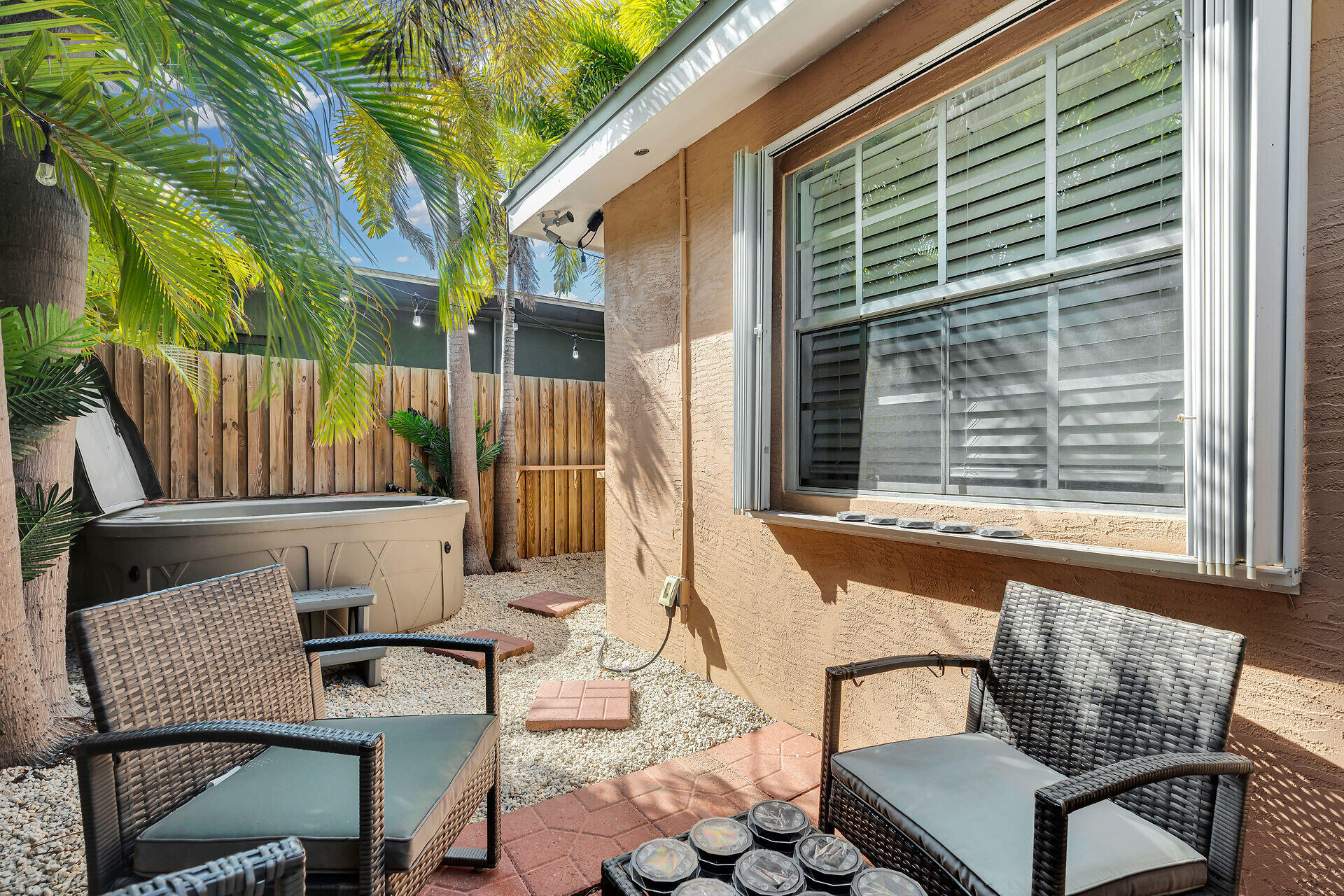 1119 Simonton Street, Unit A1 Key West, FL 33040 - Photo 15 of 18 a view of an outdoor sitting area with brick walls
