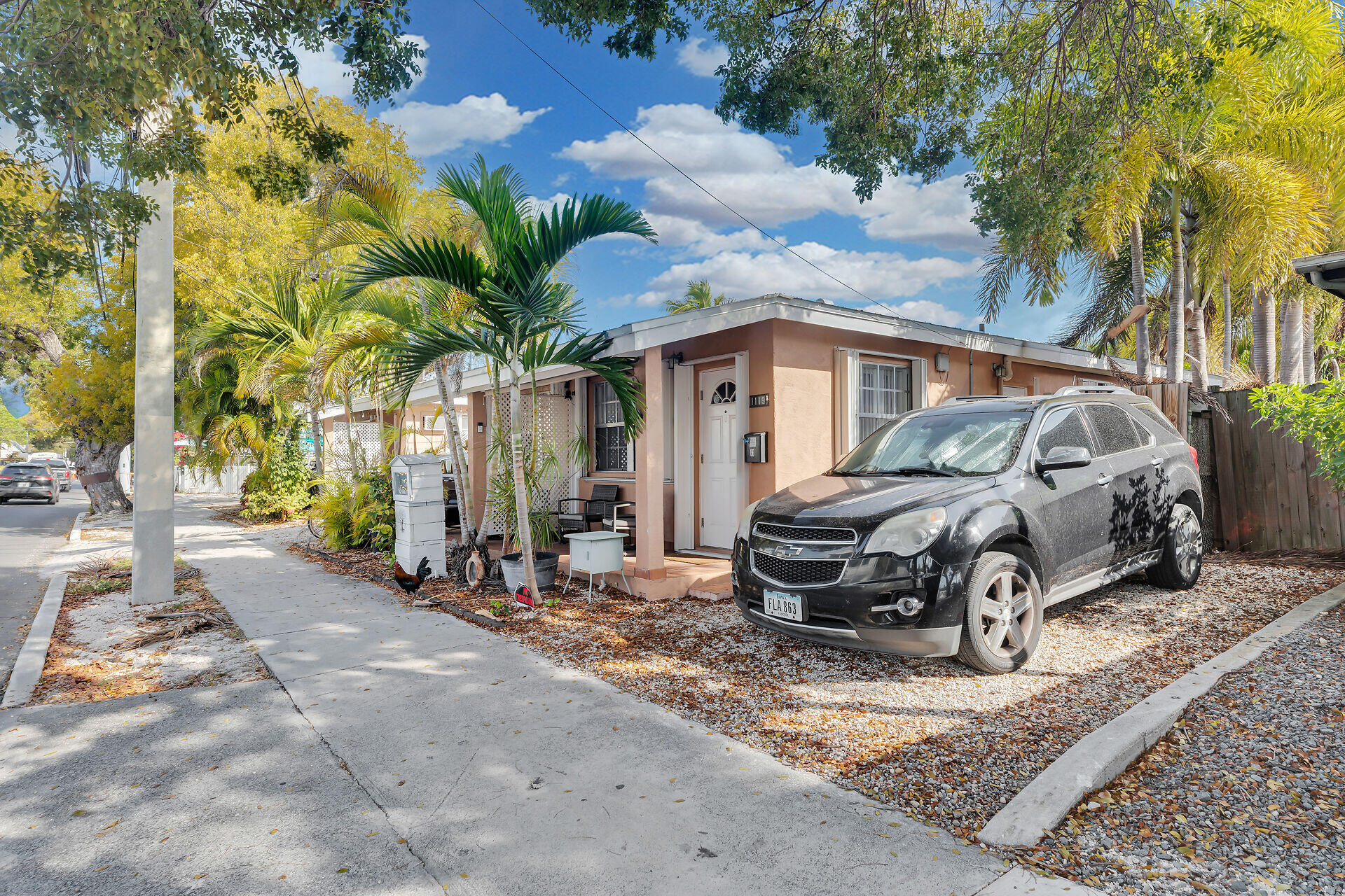 1119 Simonton Street, Unit A1 Key West, FL 33040 - Photo 17 of 18 a car parked in front of a house