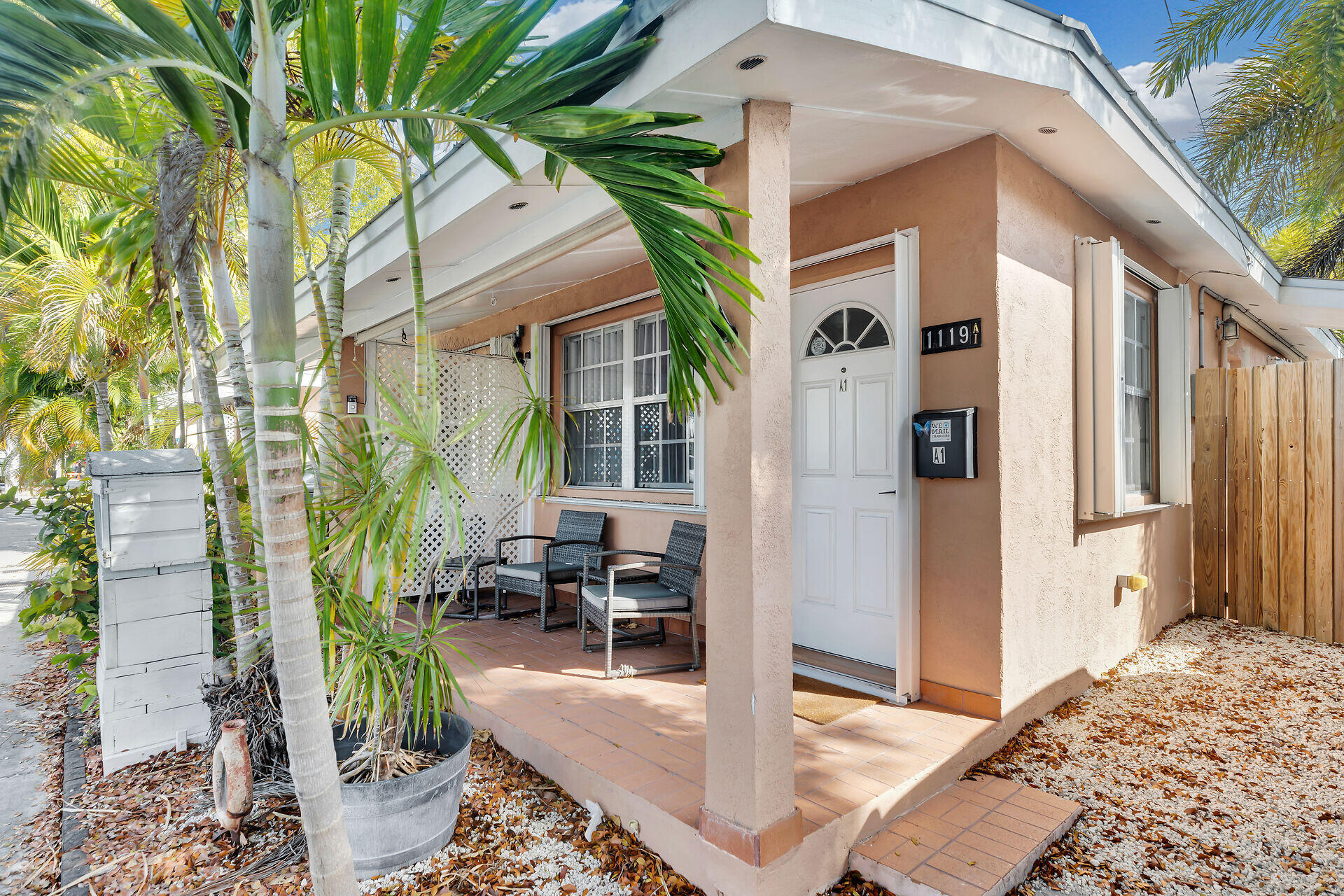 1119 Simonton Street, Unit A1 Key West, FL 33040 - Photo 3 of 18 a front view of a house with outdoor seating