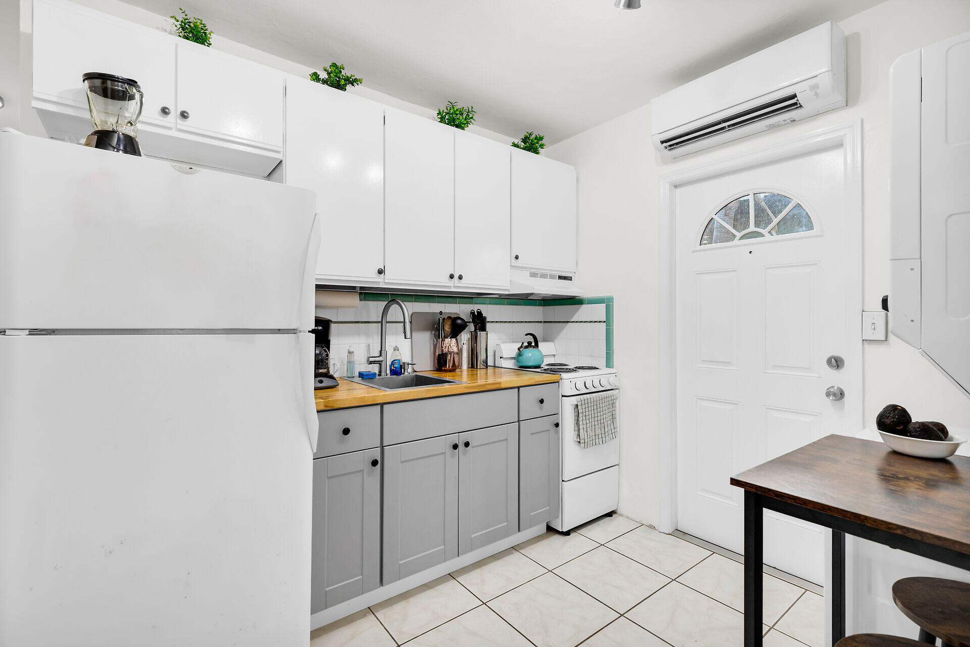 1119 Simonton Street, Unit A1 Key West, FL 33040 - Photo 7 of 18 a kitchen with cabinets and appliances