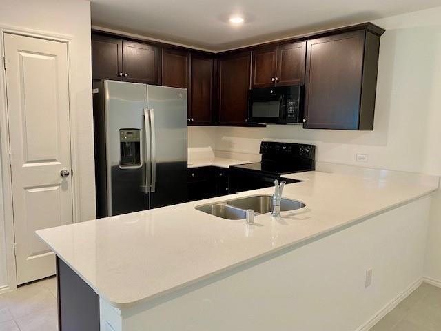 3232 Peyton Lila Road Dallas, TX 75212 - Photo 5 of 17 a kitchen with stainless steel appliances a refrigerator and sink