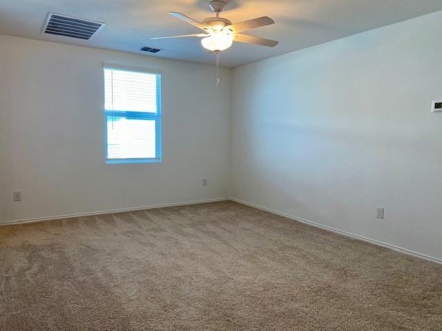 3232 Peyton Lila Road Dallas, TX 75212 - Photo 10 of 17 an empty room with a window and a fan