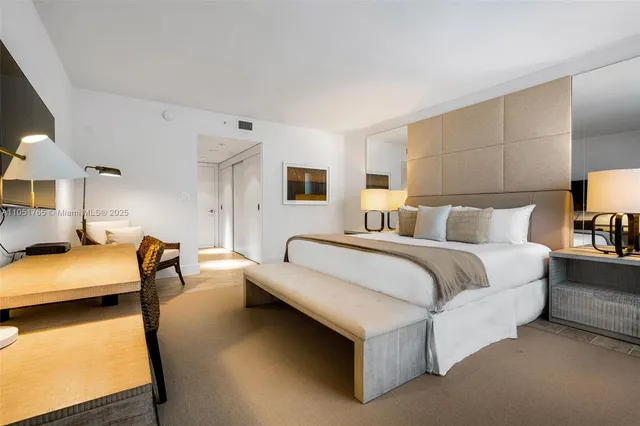 a bedroom with bed and a lamp with window