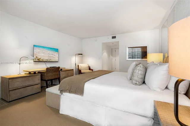 a bedroom with bed and window