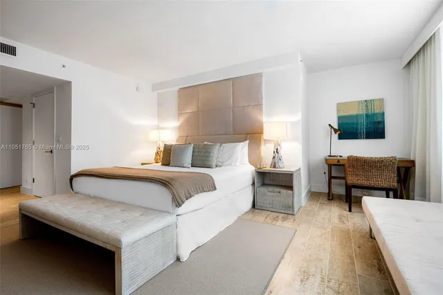 a bedroom with a bed and a couch