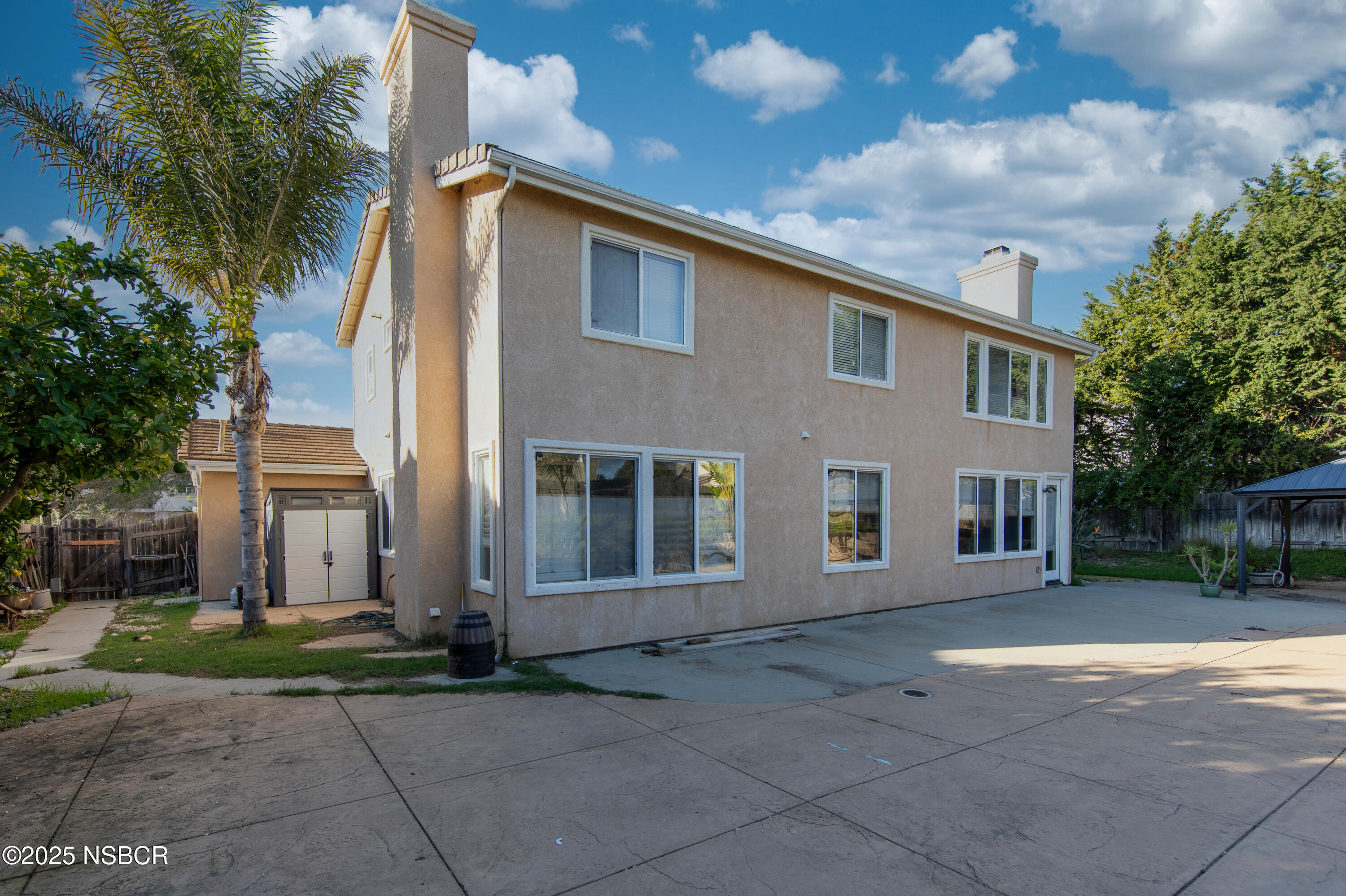 2324 Carrizo Lompoc, CA 93436 - Photo 50 of 62 a front view of a house with a yard and garage