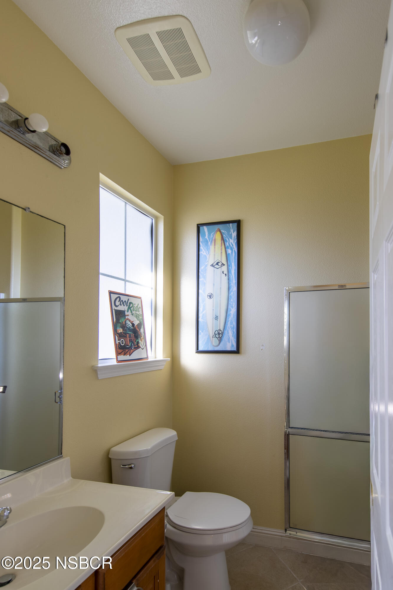 2324 Carrizo Lompoc, CA 93436 - Photo 60 of 62 a bathroom with a toilet a sink and mirror