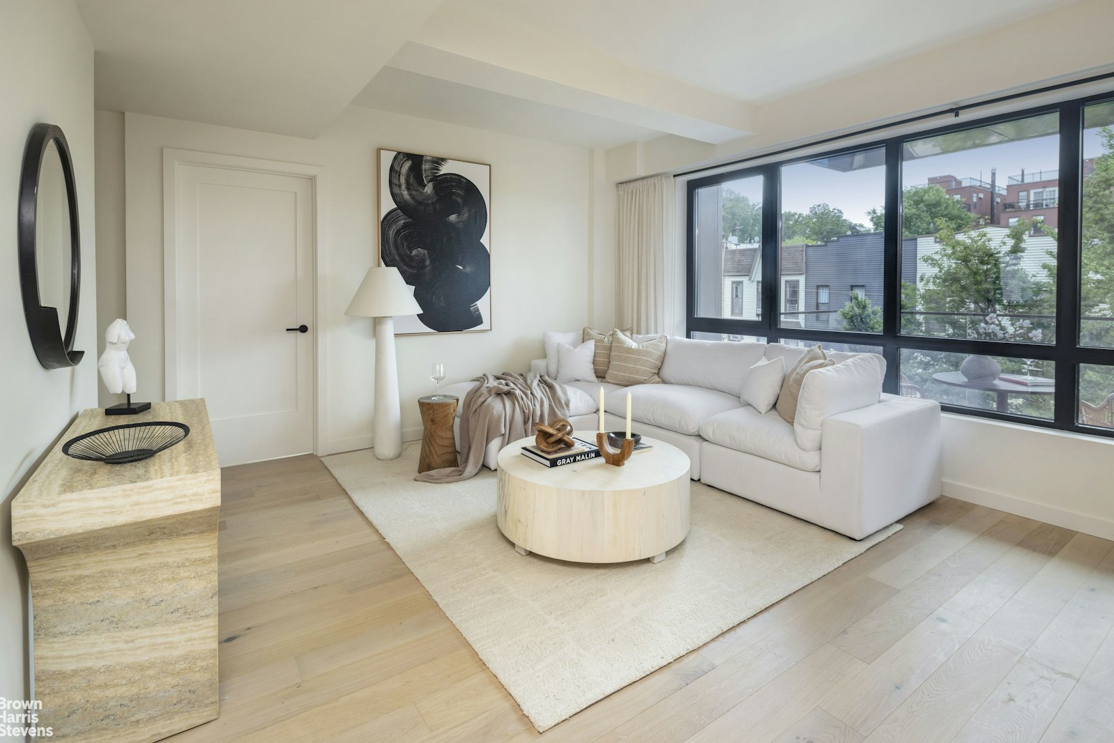 353 20th Street, Unit PH Brooklyn, NY 11215 - Photo 2 of 12 a living room with furniture and a floor to ceiling window