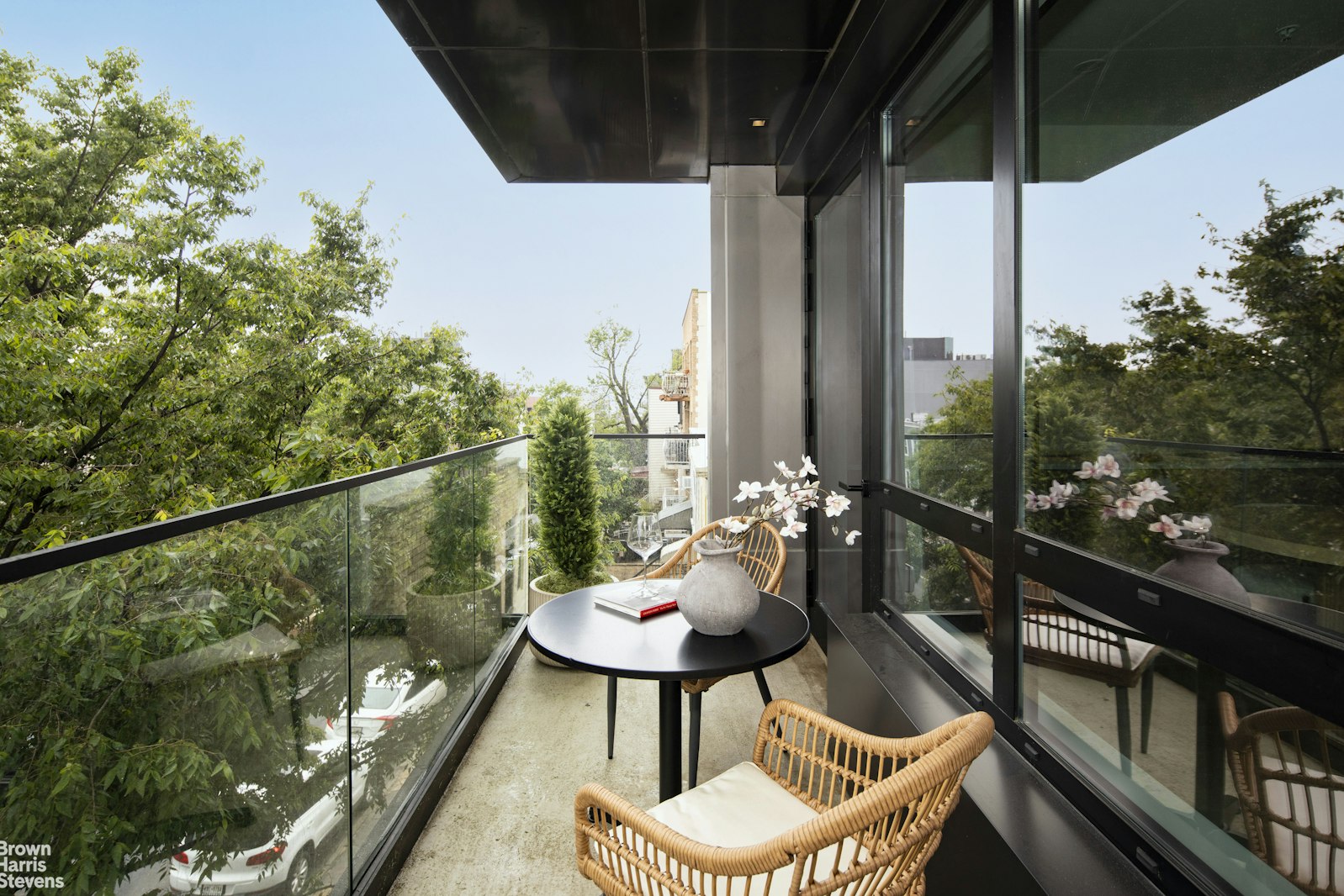 353 20th Street, Unit PH Brooklyn, NY 11215 - Photo 5 of 12 a balcony with chairs and a potted plant