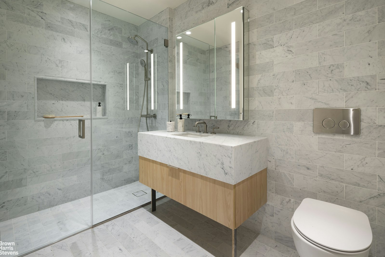 353 20th Street, Unit PH Brooklyn, NY 11215 - Photo 8 of 12 a bathroom with a sink a toilet and shower