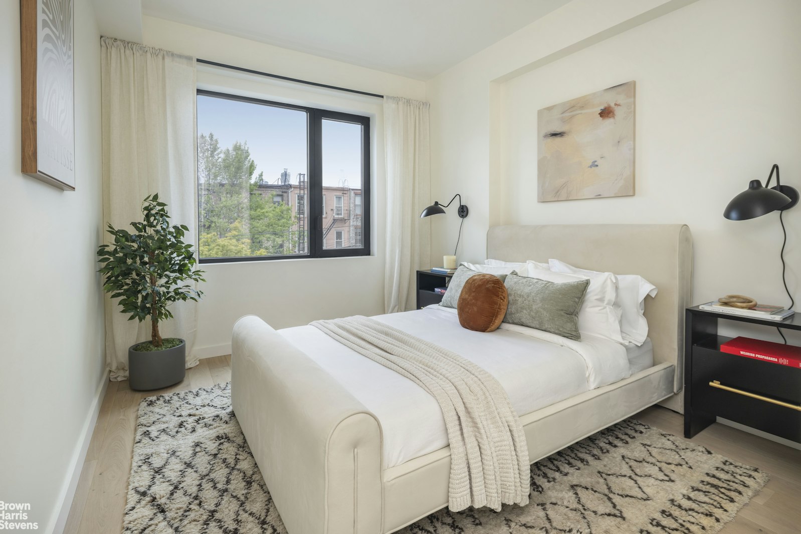 353 20th Street, Unit PH Brooklyn, NY 11215 - Photo 9 of 12 a bedroom with a large bed and a potted plant