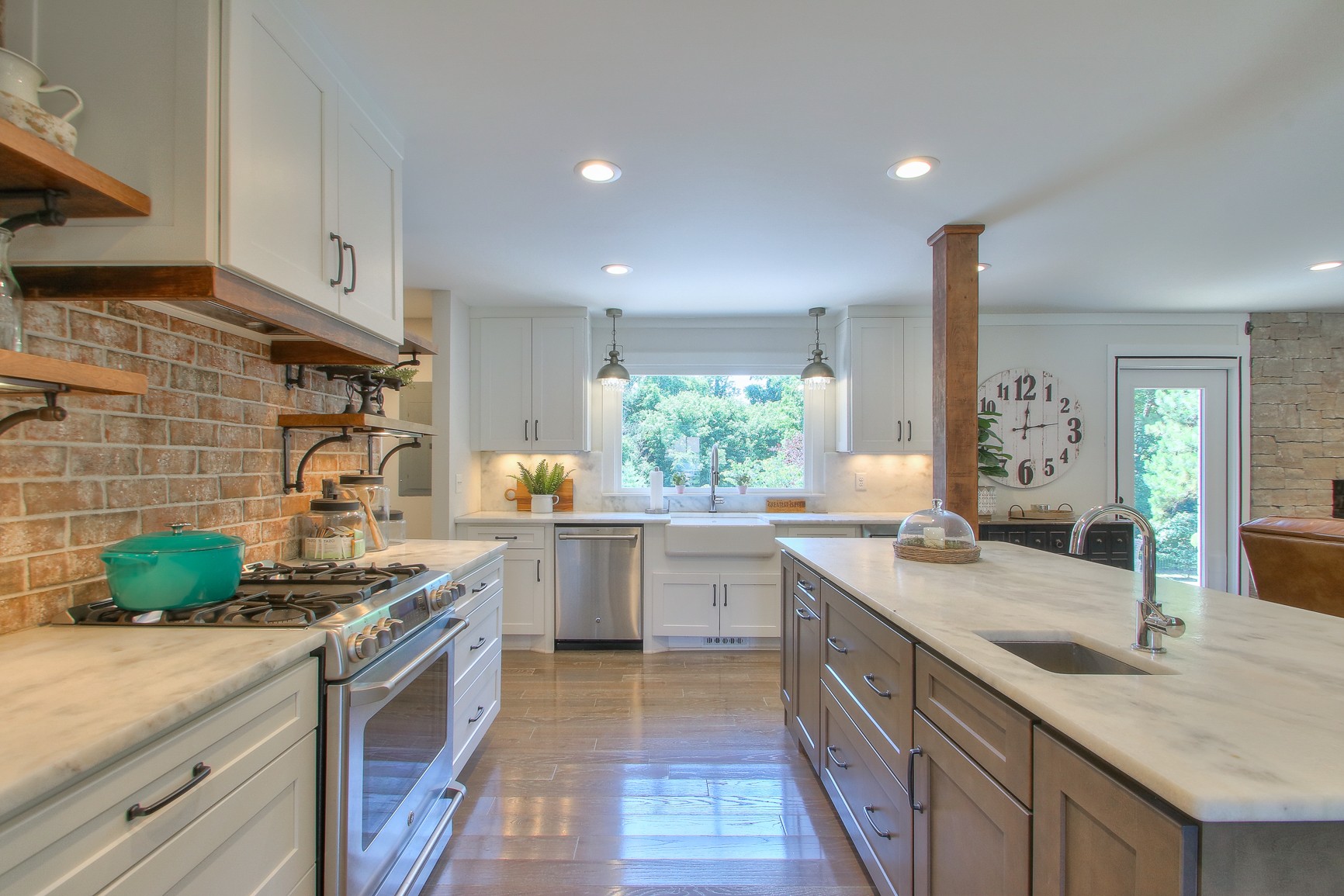 183 Lancaster Drive Franklin, TN 37064 - Photo 13 of 50 a kitchen with kitchen island granite countertop a sink stove and cabinets