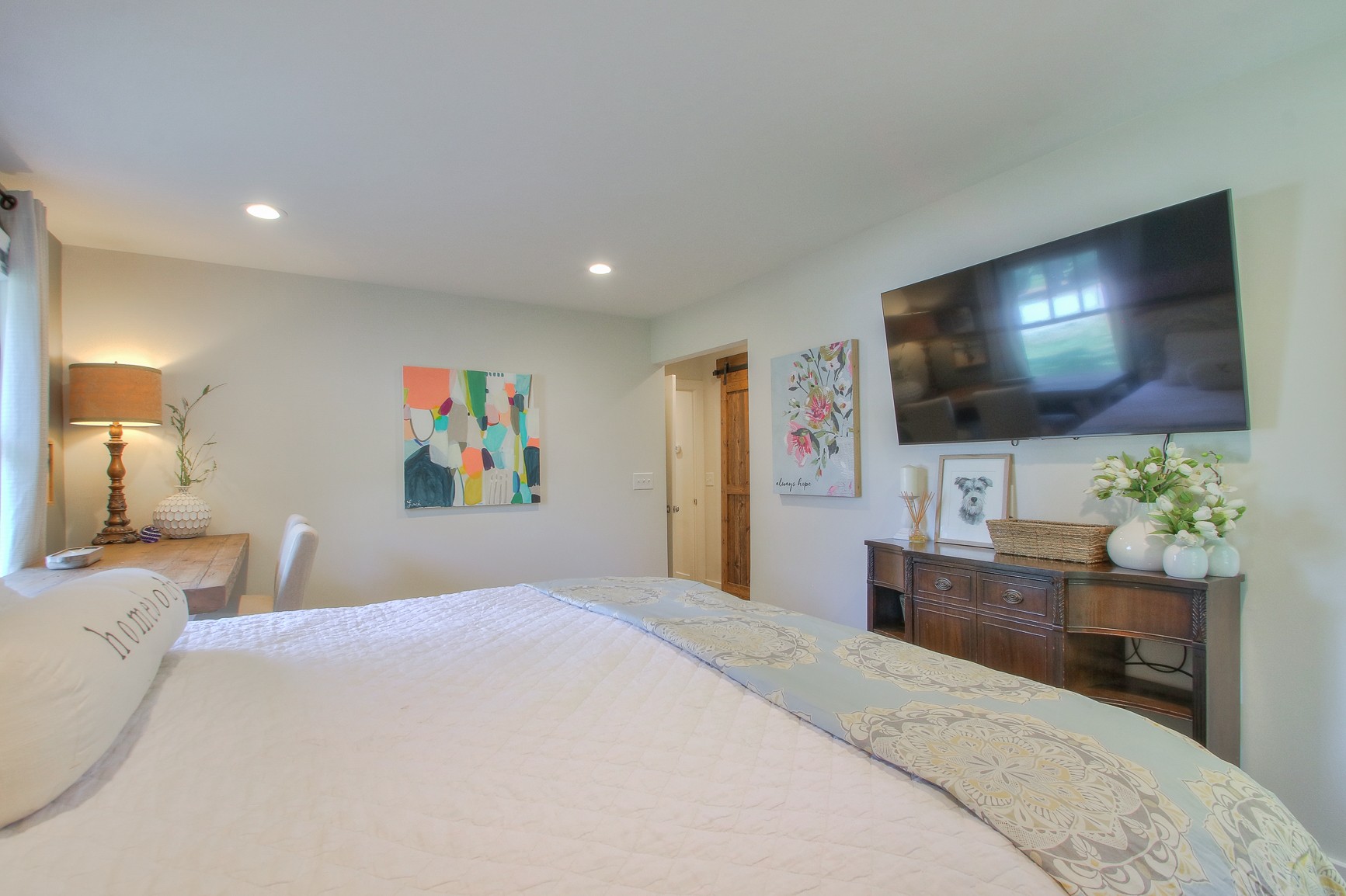 183 Lancaster Drive Franklin, TN 37064 - Photo 23 of 50 a bedroom with a bed and a flat screen tv