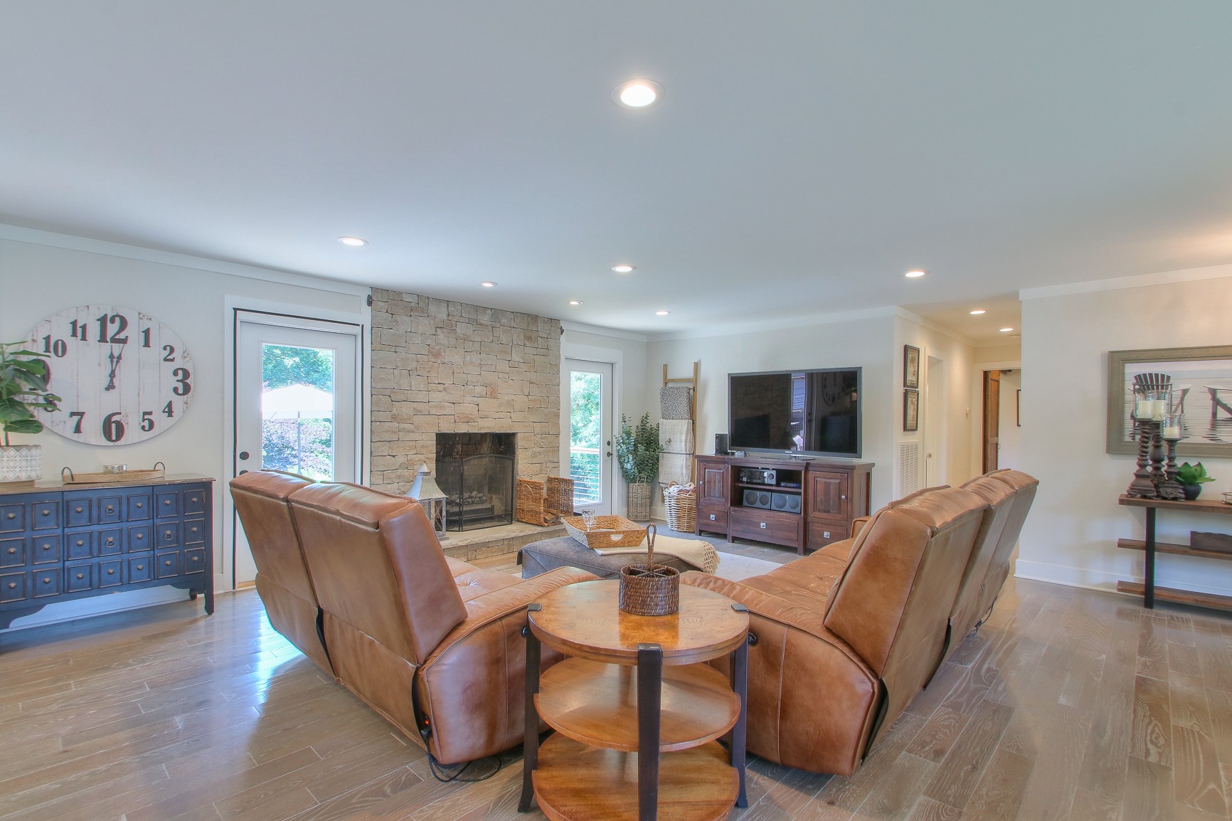 183 Lancaster Drive Franklin, TN 37064 - Photo 4 of 50 a living room with furniture a flat screen tv and a fireplace