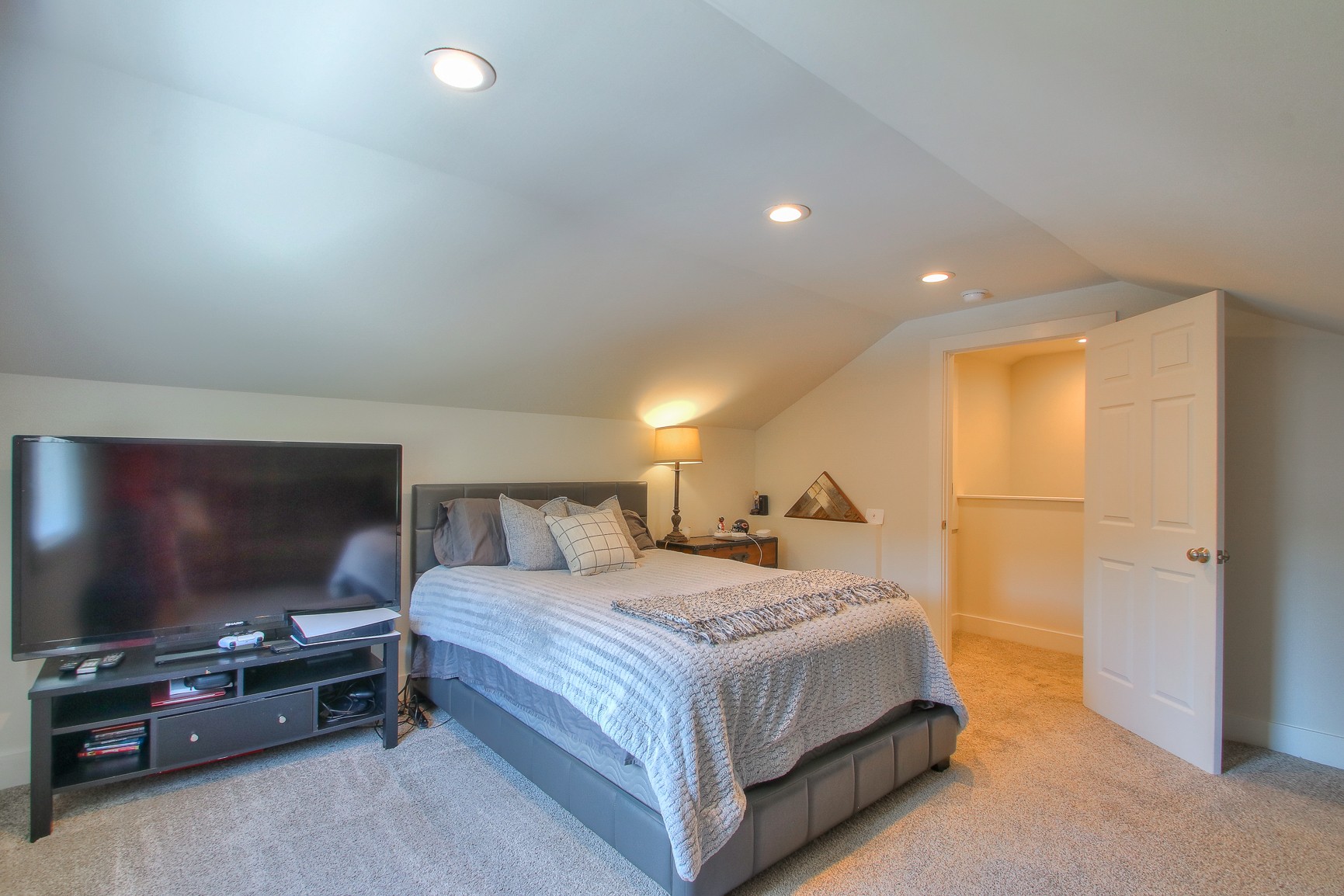 183 Lancaster Drive Franklin, TN 37064 - Photo 32 of 50 a bedroom with a bed and a flat screen tv