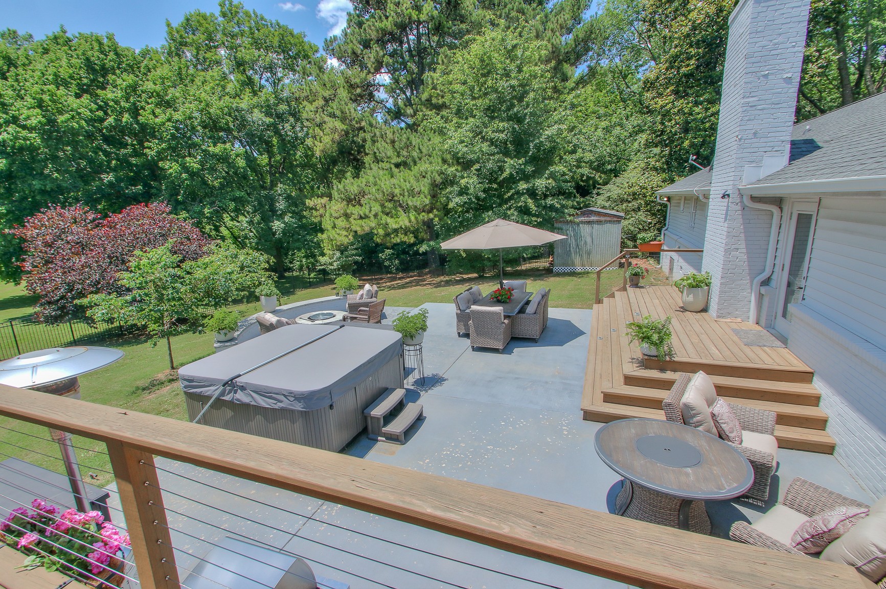 183 Lancaster Drive Franklin, TN 37064 - Photo 36 of 50 a view of a patio with couches table and chairs under an umbrella with a barbeque