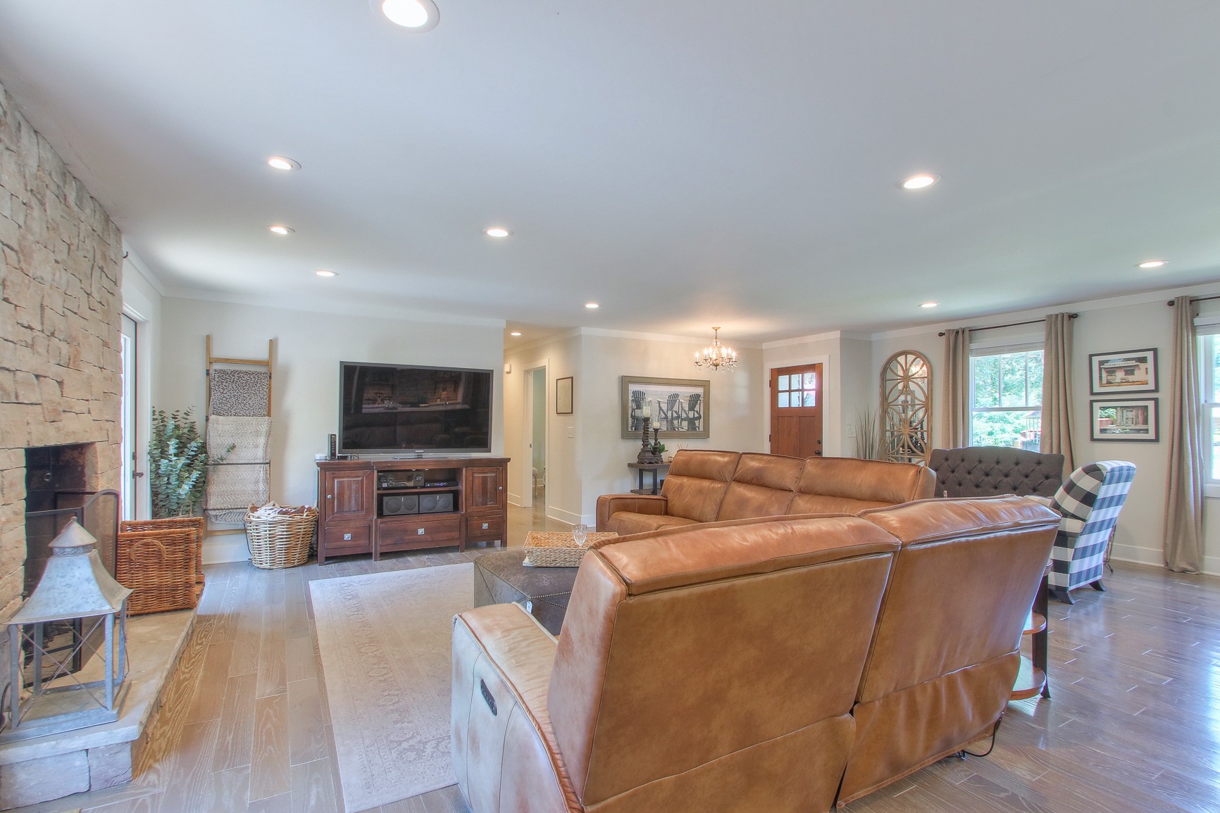 183 Lancaster Drive Franklin, TN 37064 - Photo 6 of 50 a living room with furniture a fireplace and a flat screen tv