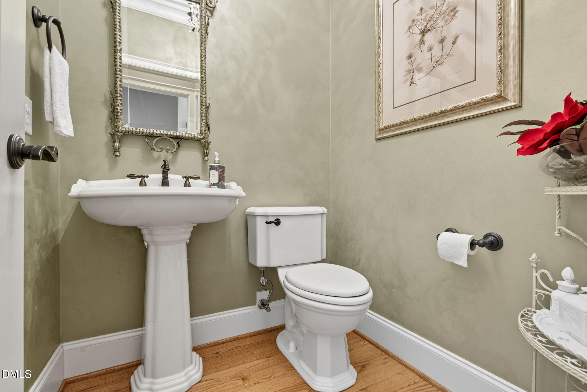 2603 Peachleaf Street Raleigh, NC 27614 - Photo 40 of 90 a bathroom with a sink toilet and a mirror