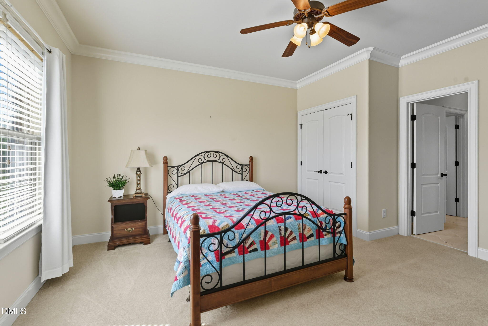 2603 Peachleaf Street Raleigh, NC 27614 - Photo 65 of 90 a bedroom with a bed and a chandelier