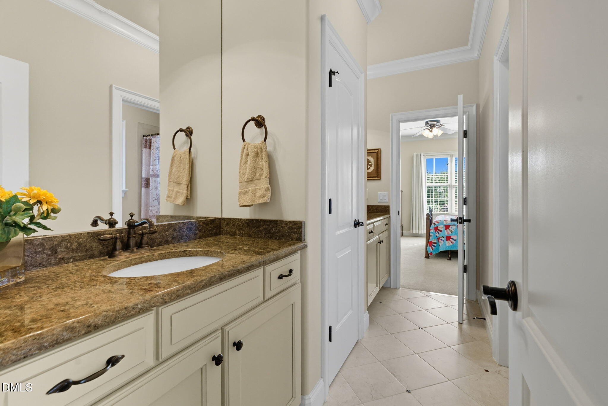 2603 Peachleaf Street Raleigh, NC 27614 - Photo 68 of 90 a spacious bathroom with a granite countertop sink and a mirror