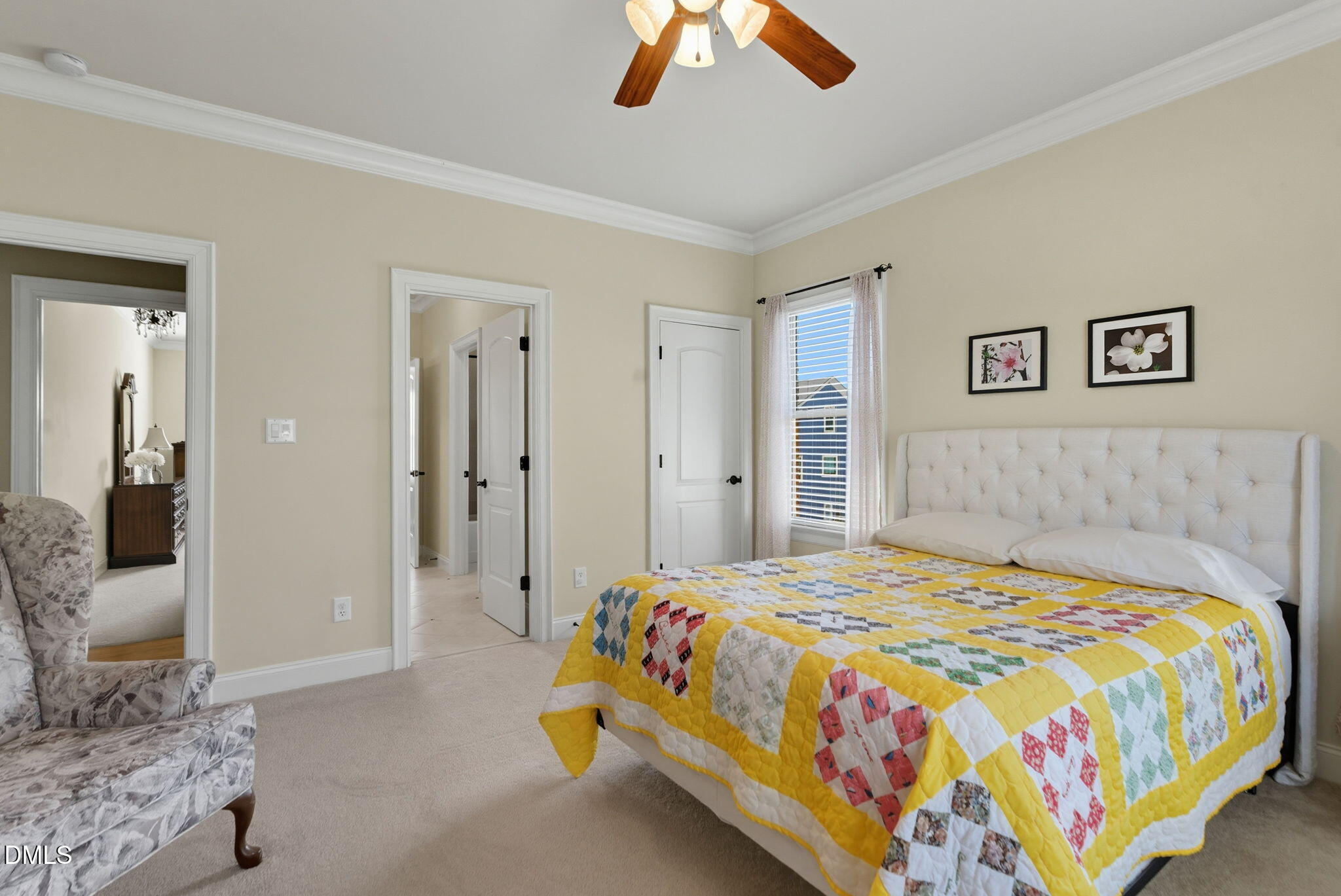 2603 Peachleaf Street Raleigh, NC 27614 - Photo 70 of 90 a bedroom with a bed and a chandelier