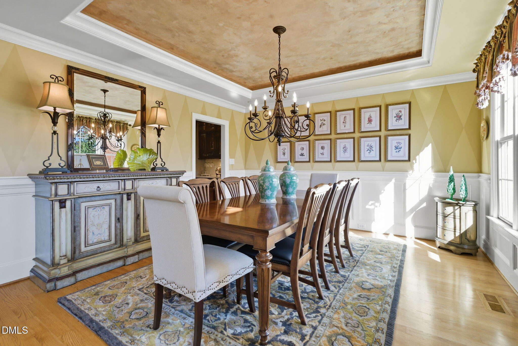 2603 Peachleaf Street Raleigh, NC 27614 - Photo 7 of 90 a view of a dining room with furniture a chandelier and wooden floor