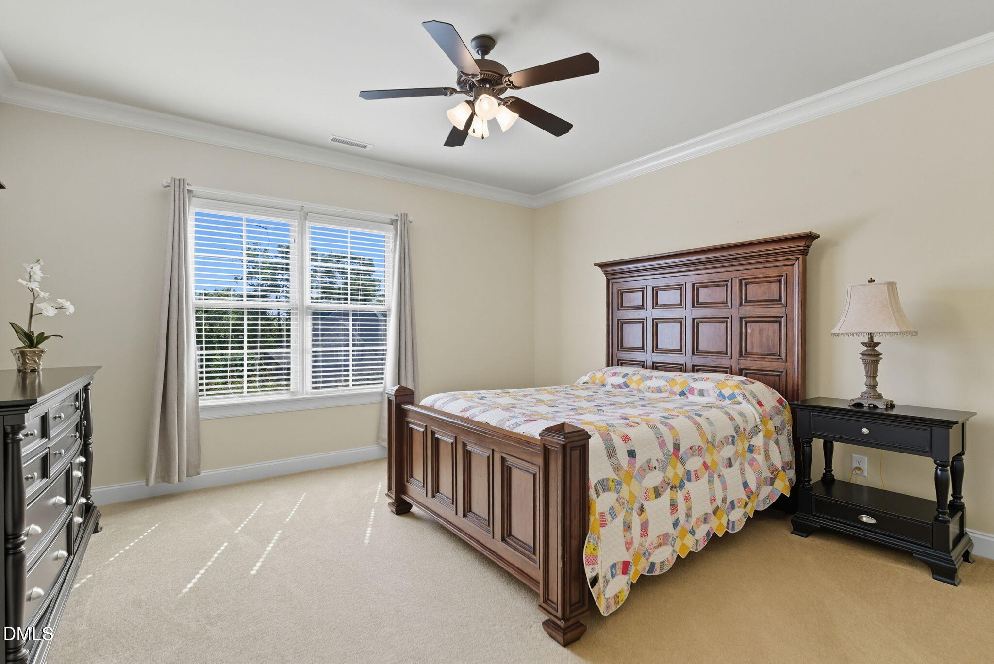 2603 Peachleaf Street Raleigh, NC 27614 - Photo 72 of 90 a bedroom with a bed next to a window and a chandelier