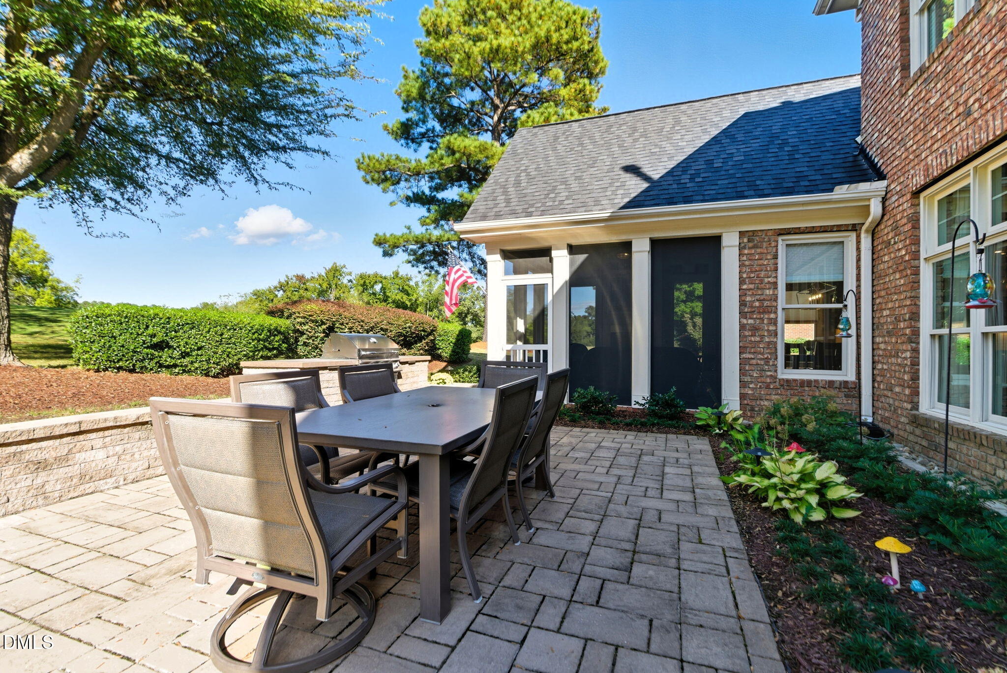 2603 Peachleaf Street Raleigh, NC 27614 - Photo 80 of 90 a view of a patio with table and chairs potted plants and floor to ceiling window