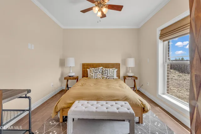 a bedroom with a bed and window