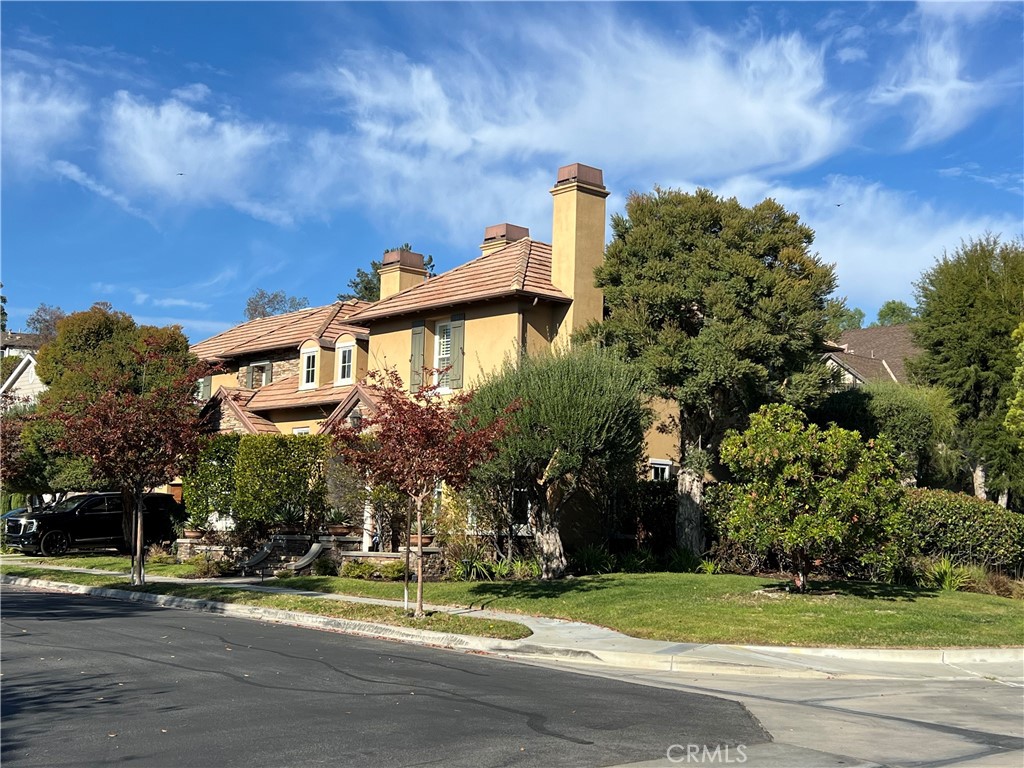 a street sign on a sidewalk next to a road