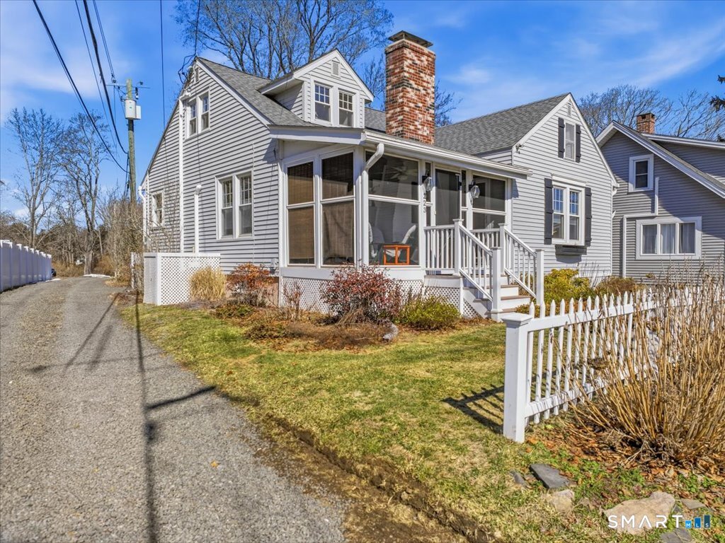 223 Water Street Guilford, CT 06437 - Photo 1 of 1 a front view of a house with a yard