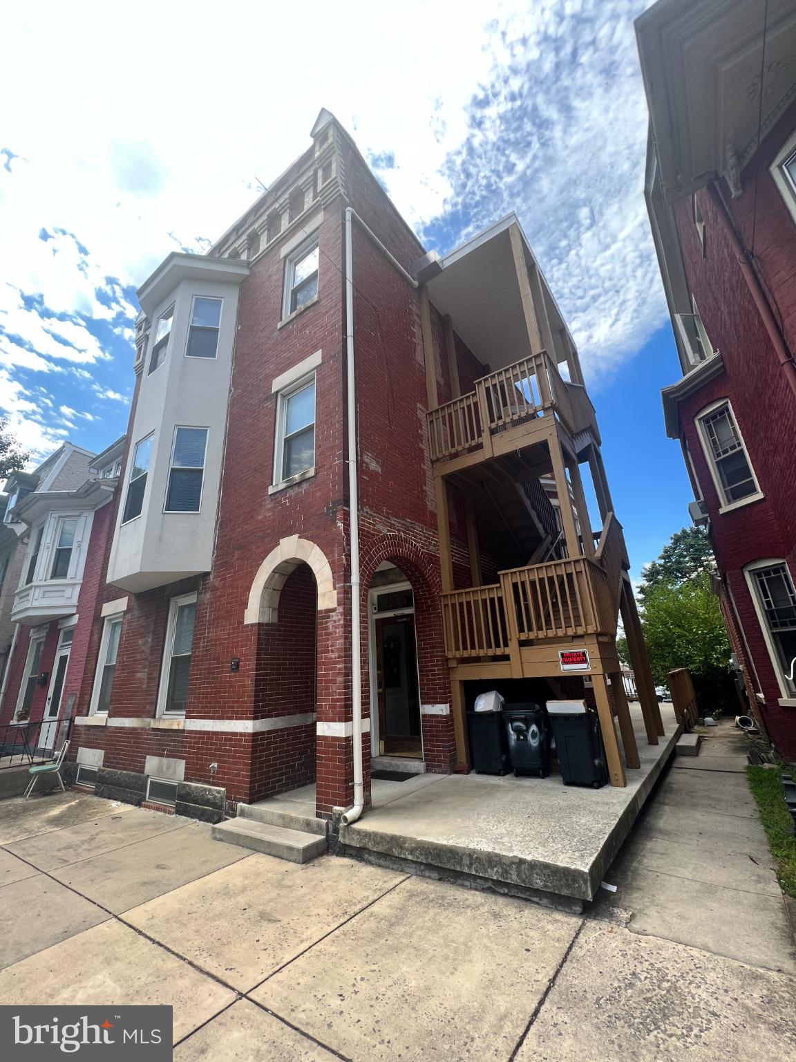255 South Potomac Street, Unit 2 Hagerstown, MD 21740 - Photo 16 of 18 a front view of a house with parking