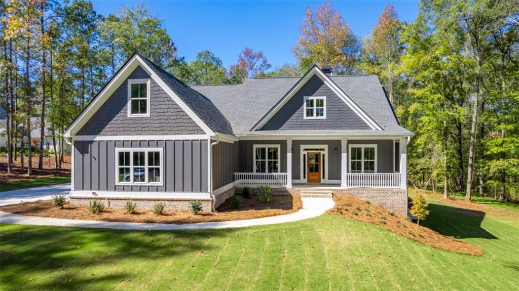 1169 Dean Hill Road Southeast Monroe, GA 30655 - Photo 1 of 1 a front view of house with yard and green space