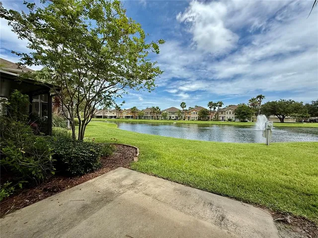 a view of a lake with a big yard