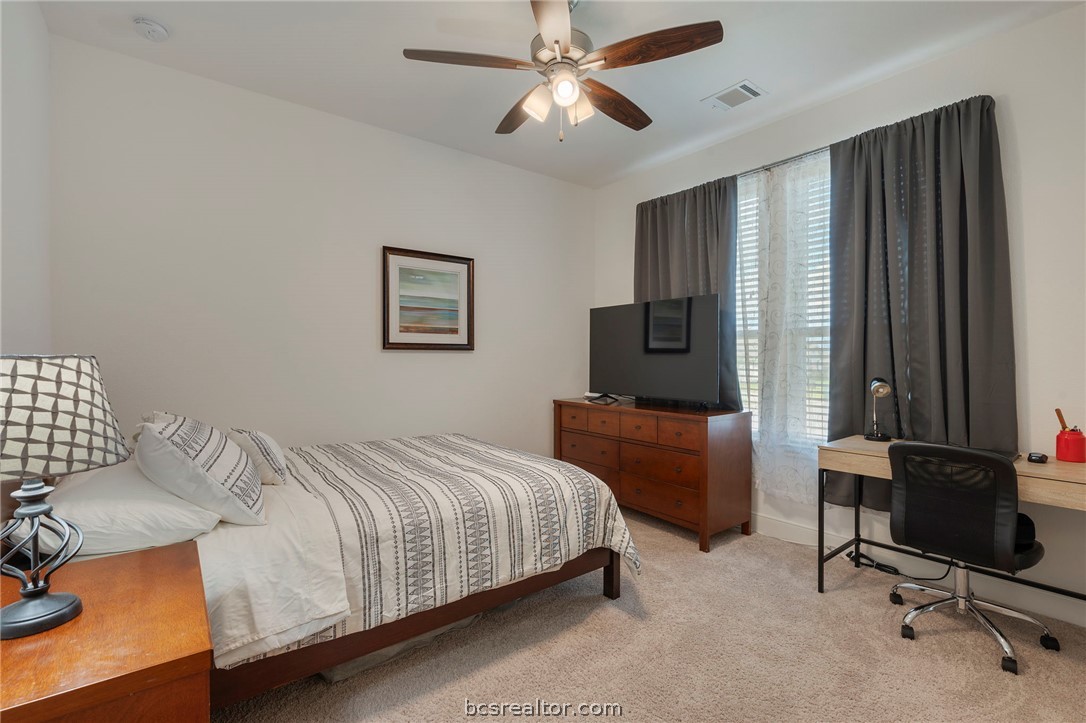 3500 Abingdon Cove Bryan, TX 77808 - Photo 14 of 23 a bedroom with a bed and a chair